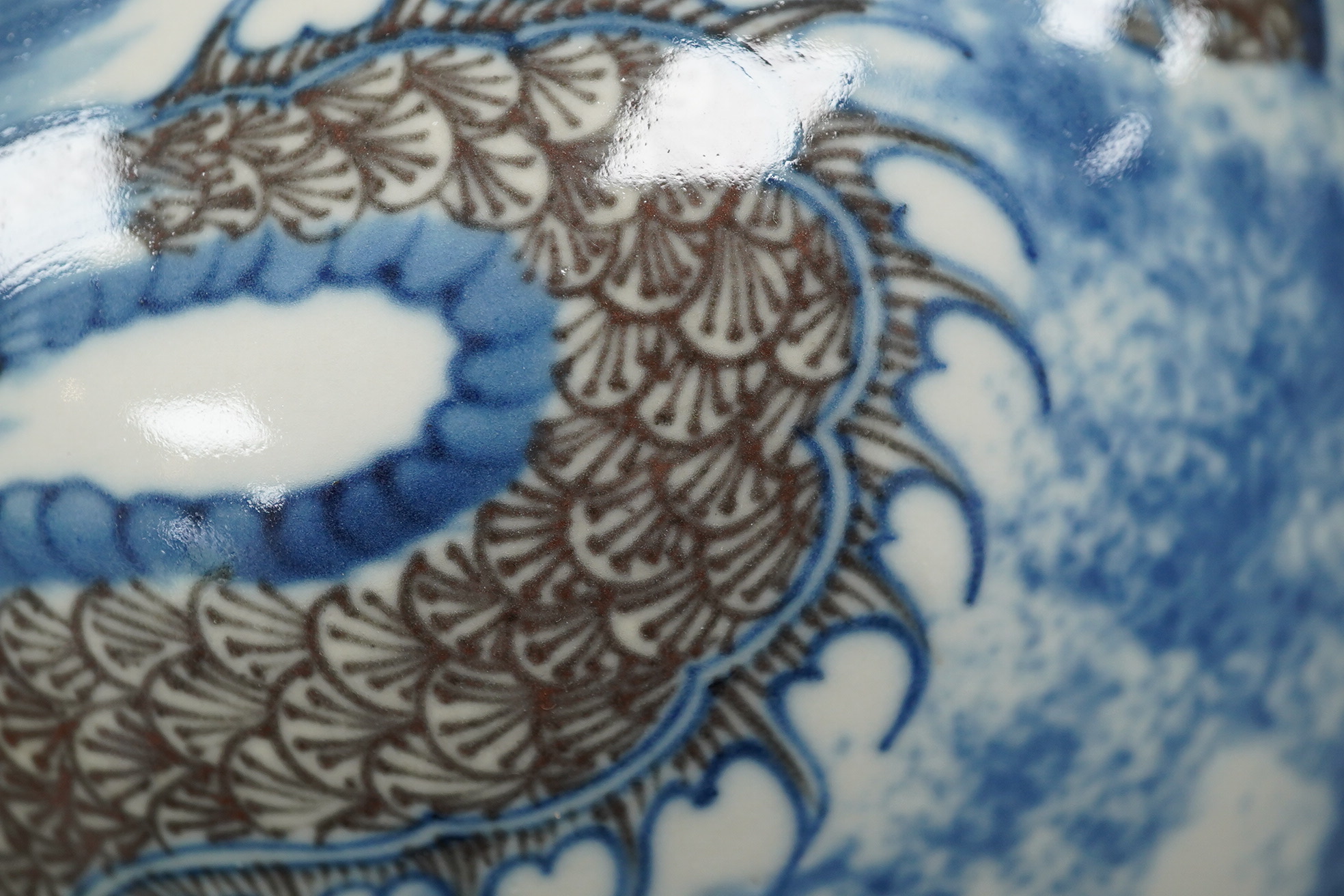 A Chinese underglaze blue and copper red ’dragon and tiger’ baluster vase, possibly 19th century